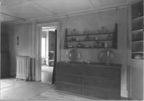 SA0672 - An unidentified interior, showing a chest with metal ware and a hanging rack., Winterthur Shaker Photograph and Post Card Collection 1851 to 1921c